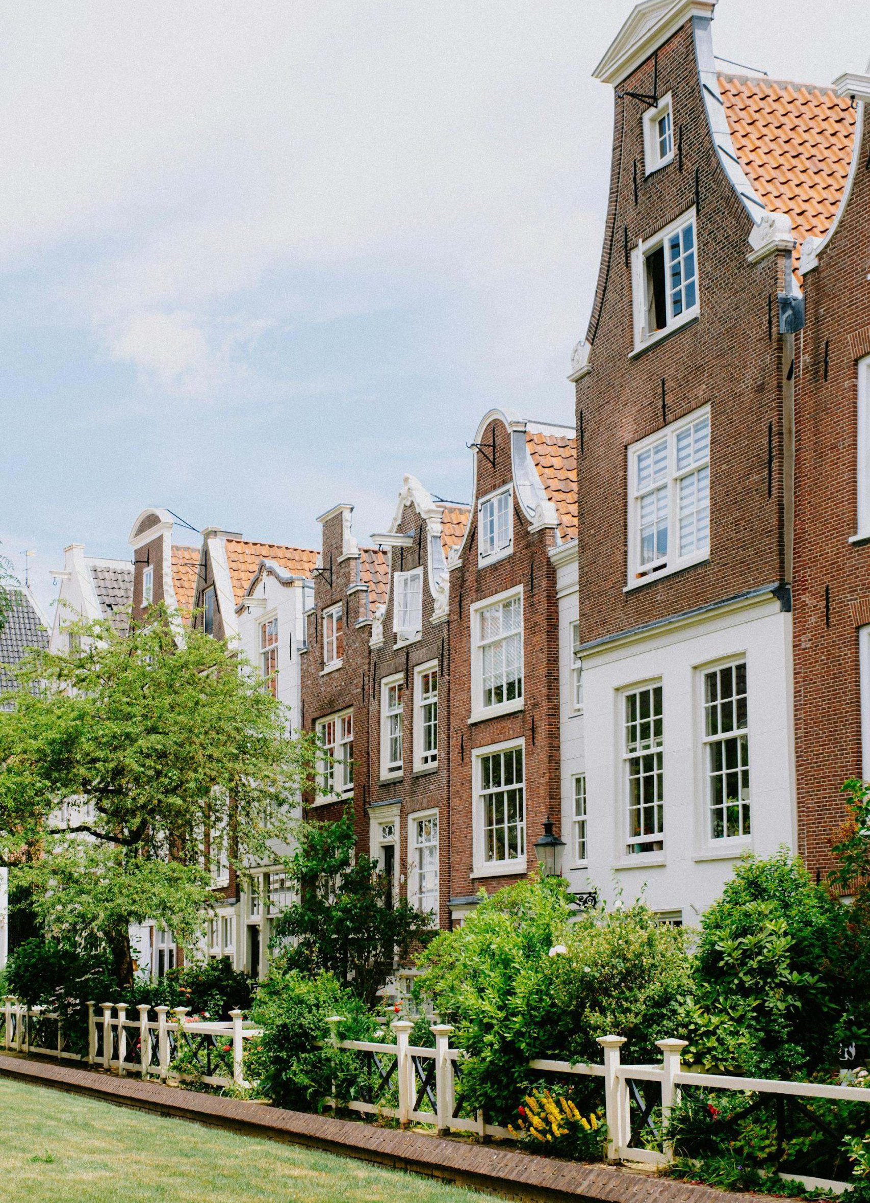 The serene Begijnhof courtyard in Amsterdam, featuring well-preserved medieval houses and lush gardens.